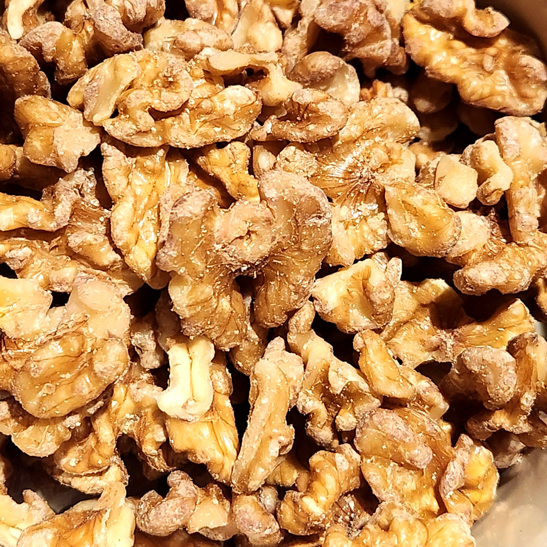 Close-up of walnuts with a brown background