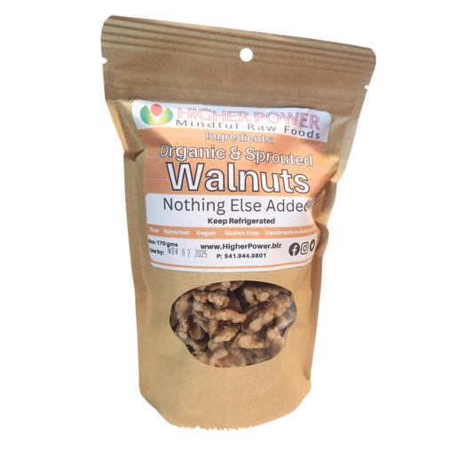 Kraft paper bag of organic sprouted walnuts with Higher Power label on a white background
